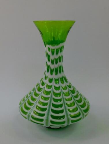 A green art glass vase