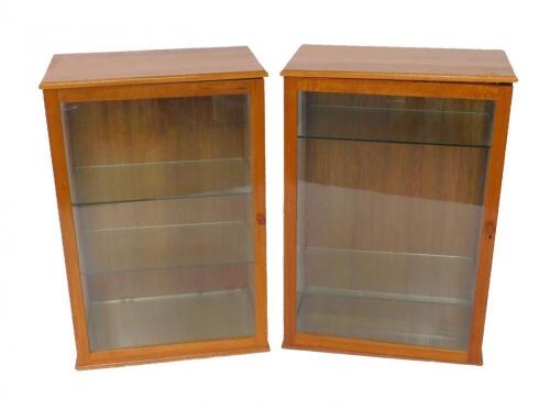A pair of mahogany display cabinets