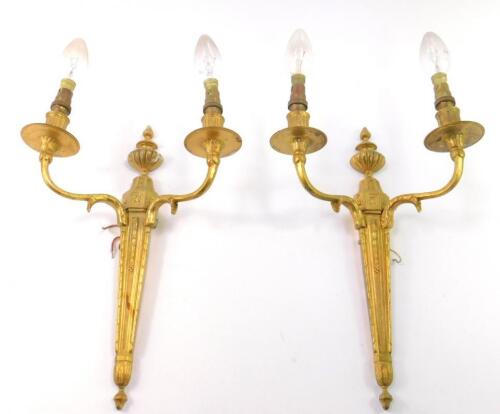 A pair of Adam style brass twin branch wall lights