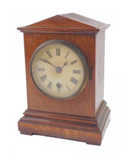 A Victorian oak cased mantel clock of architectural form