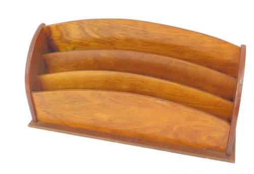 An oak three division stationery rack