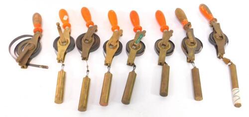 Eight Rabone Chesterman weighted steel and brass cased tape measures