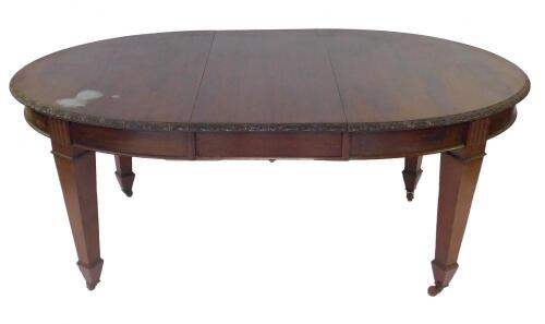 A Victorian mahogany wind-out dining table