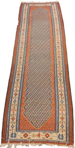 A Caucasian runner decorated with repeating floral motifs