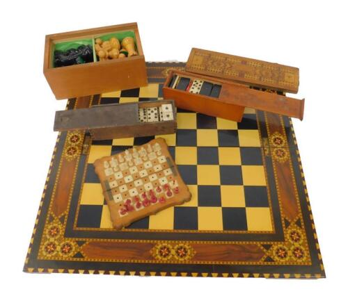 A Victorian white and red stained ivory travelling chess set