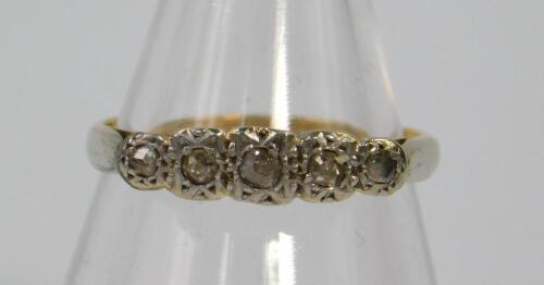 A rose cut diamond five stone ring