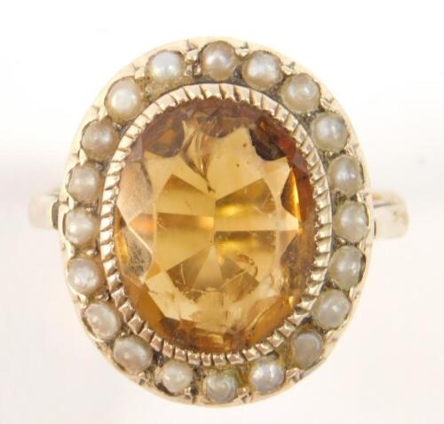 An oval cut citrine ring
