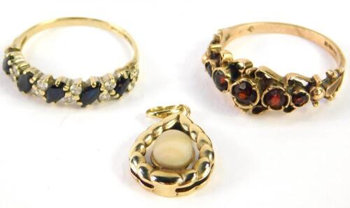 A 9ct gold and garnet five stone ring