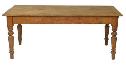 A pine double plank top kitchen table