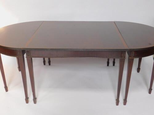 A Georgian style mahogany and cross banded D end dining table
