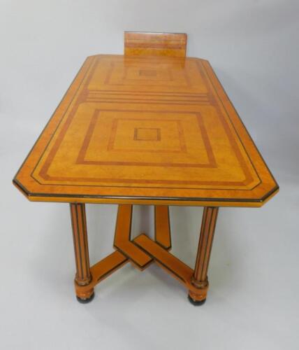 A Camille and Vence Biedermeier style satin birch burr yew and ebonised refectory draw leaf dining t