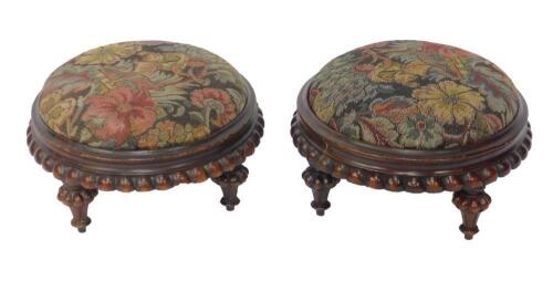 A pair of Victorian mahogany foot stools