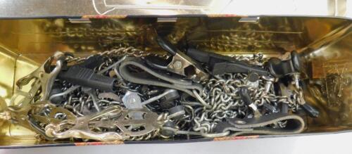 A collection of metal nipple clamps.
