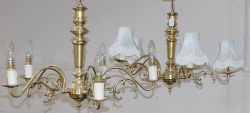 A pair of Victorian style brass five branch chandeliers.