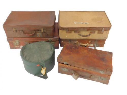 Three leather bound suitcases