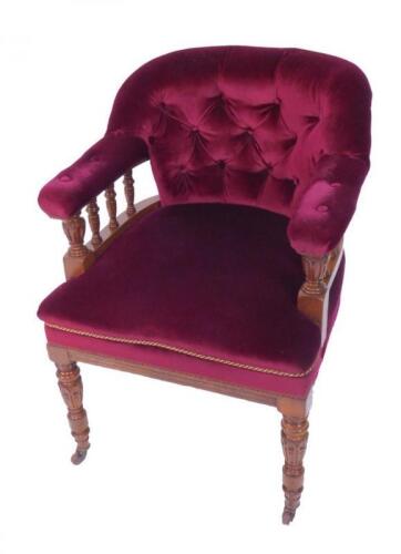 A Victorian oak tub library chair