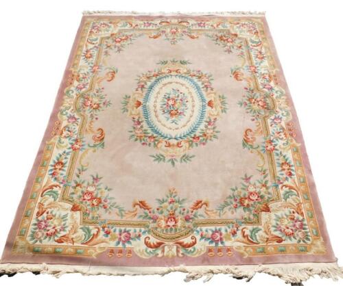 A Chinese pink ground rug