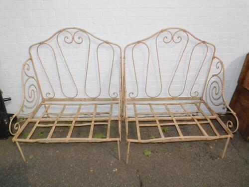 A pair of French cream painted cast iron garden seats