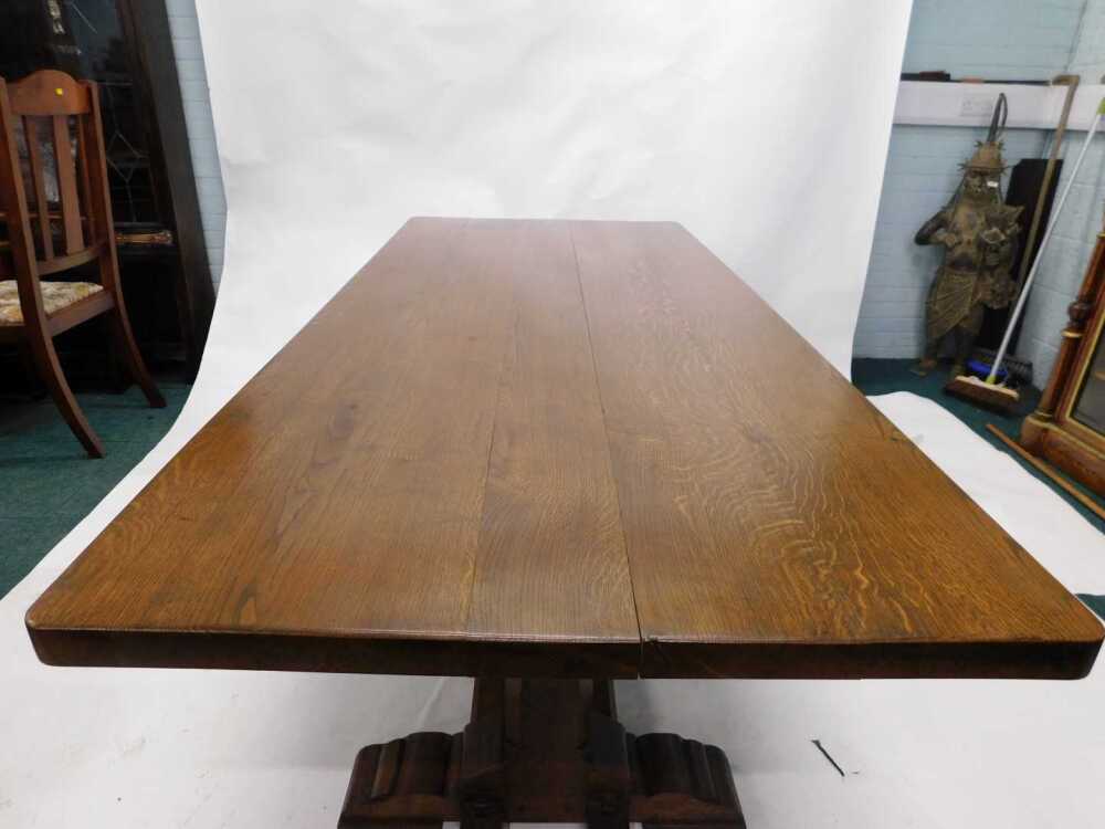 An oak refectory table, the rectangular top with rounded corners, on ...