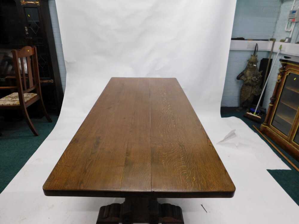 An oak refectory table, the rectangular top with rounded corners, on ...
