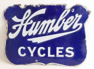 A Humber CYCLES enamel advertising sign, of shield form, navy ground, double-sided, 45cm x 60cm.... - 3