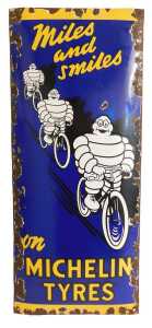 A MICHELIN TYRES enamel advertising sign, Miles and Smiles on MICHELIN TYRES, depicting three...