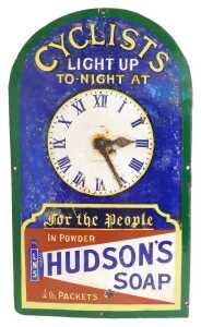 A HUDSON'S SOAP enamel advertising clock sign, CYCLISTS LIGHT UP TO-NIGHT AT, multicoloured...