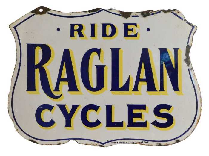 A RAGLAN CYCLES enamel shield advertising sign, RIDE RAGLAN CYCLES, white ground with blue and...