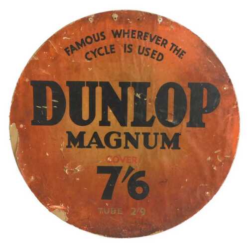 A DUNLOP MAGNUM advertising sign, FAMOUS WHEREVER THE CYCLE IS USED 7/6, red ground, cardboard...