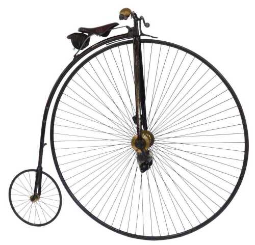 A 19thC penny farthing or ordinary bicycle, the black and red painted frame with a brass bell...