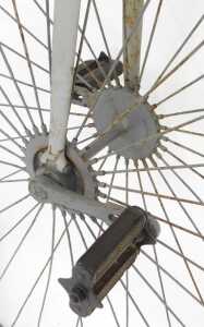 A penny farthing or ordinary bicycle, the painted grey frame with a partial leather seat, and... - 5