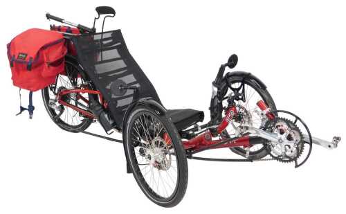 An ICE Sprint 1 recumbent tricycle, on a red frame model 4130, with cat eye micro wireless CC-MC...