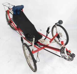 A Greenspeed recumbent tricycle, with a red frame, with Greenspeed labelling, having an Optima... - 3