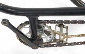 A tricycle, the black painted frame with steel and orange plastic capped handlebars, with a... - 7