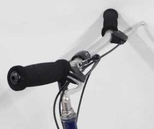A Moulton bicycle, the royal blue frame with a black seat, lacking pedals, on a single bicycle... - 3