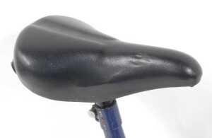A Moulton bicycle, the royal blue frame with a black seat, lacking pedals, on a single bicycle... - 4