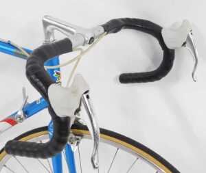 An Eddy Merckx bicycle, with a red, blue and white Columbus SL frame, with applied labels and... - 3