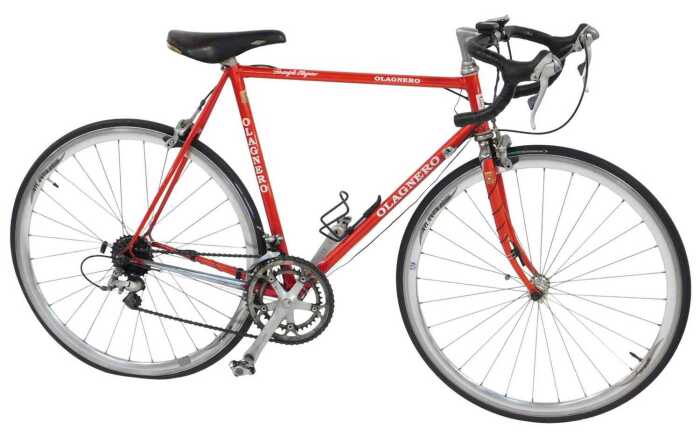 An Olagnero bicycle, the red Columbus Cara frame, with bound handlebars and Shimano 105 brakes,...