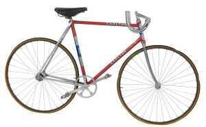 A Carlton bicycle, the Reynolds 531 red painted frame with applied crest, having chrome...