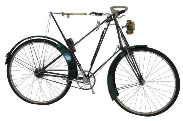 A late 19thC Dursley Peterson bicycle, the green painted frame with a cream woven and sprung...