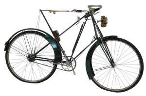 A late 19thC Dursley Peterson bicycle, the green painted frame with a cream woven and sprung...