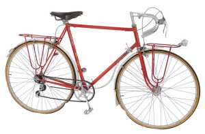 A Claud Butler bicycle, the Reynolds 531 red painted frame with CB crest and Olympic applied...