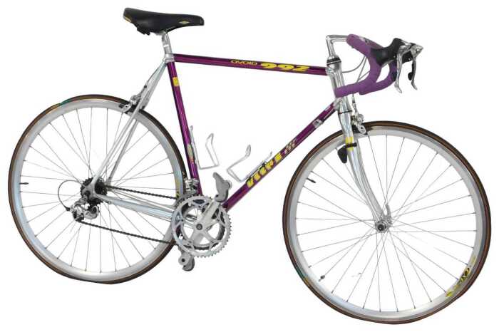 A Vitus Ovoid 222 bicycle, the purple frame with bound handlebars and Shimano 105 brakes, with...