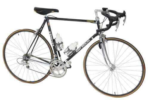 An Eddy Merckx bicycle, the Columbus TSX Corsa Extra frame with advertising and water bottles,...