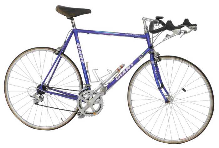 A Giant Peloton Super Light bicycle, the purple Giant Cro-moly frame with three TTT chrome...