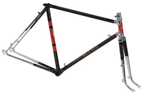 A Sun Wasp lightweight bicycle frame, with ornate polished lugs and brass head badge, black with...