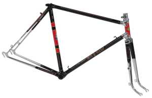 A Sun Wasp lightweight bicycle frame, with ornate polished lugs and brass head badge, black with...