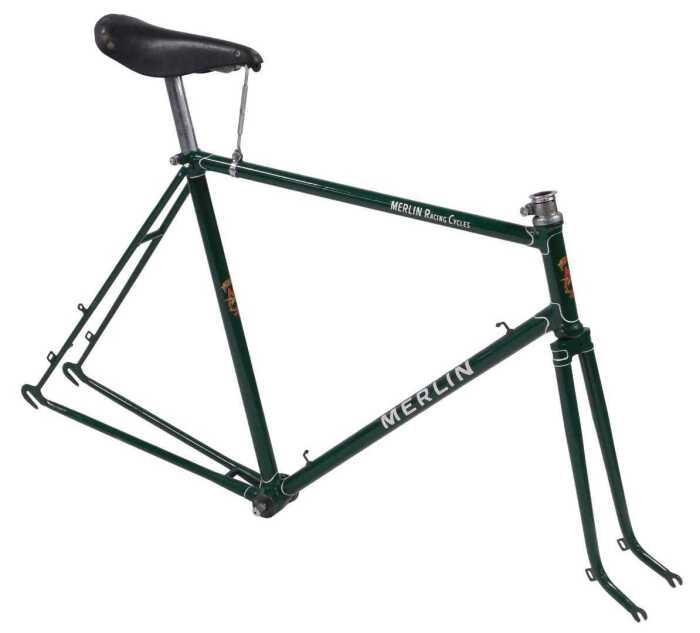 A Merlin Racing Cycles bicycle frame and fork set, green with shaped lugs and white detailing...