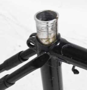 A black bicycle frame and fork set, with shaped lugs, headset and seat post. - 4