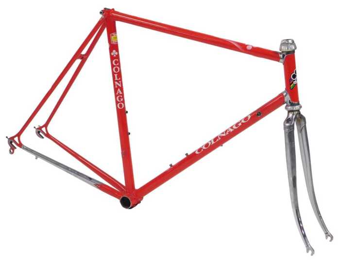 A Colnago bicycle frame and fork set, with Campagnolo Athena headset, shaped lugs, red with...